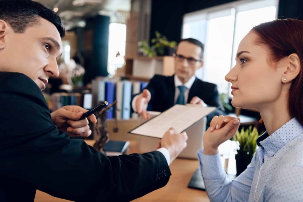 Solemn Lawyer Gives Adult Man To Sign Document On Divorce. Coupl