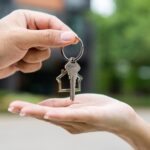 Woman buying or rent new home she holding